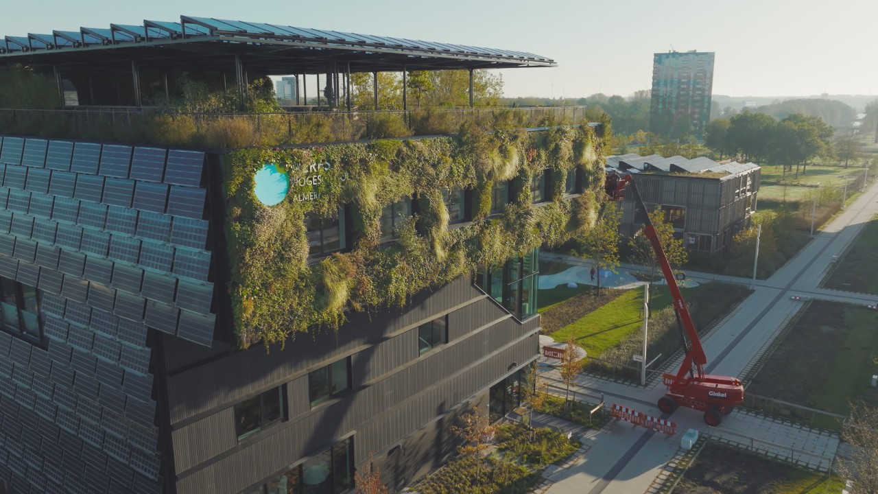 Drone shot of the Dutch Aeres University of Applied Sciences with greened façade and roof planting