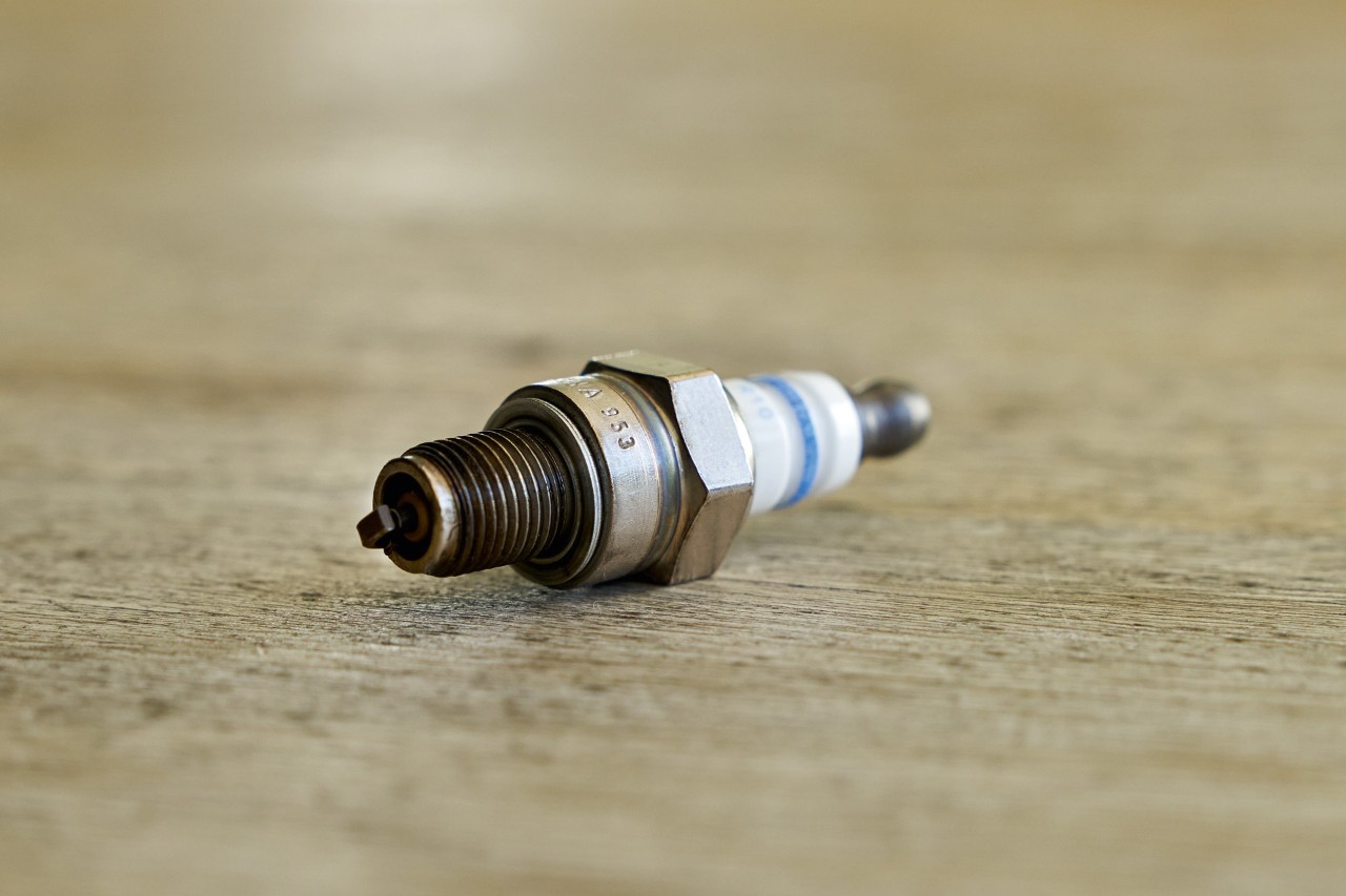 Close-up of a spark plug on a STIHL petrol brushcutter